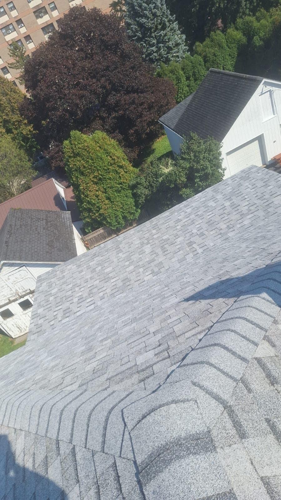 An aerial view of a roof with a lot of shingles on it.