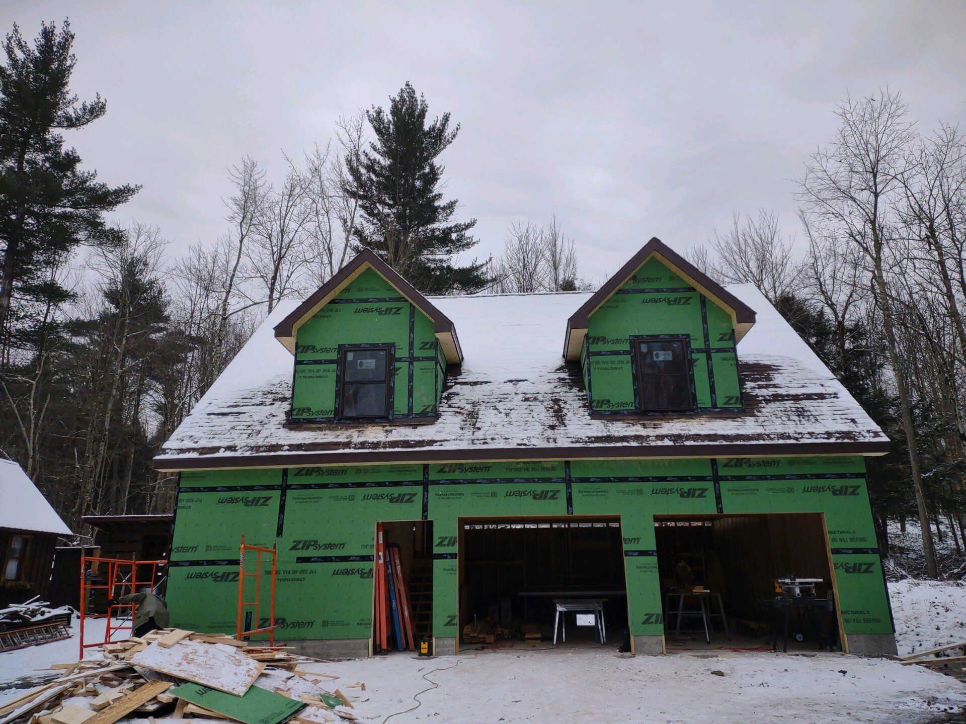 A house that is being built in the snow