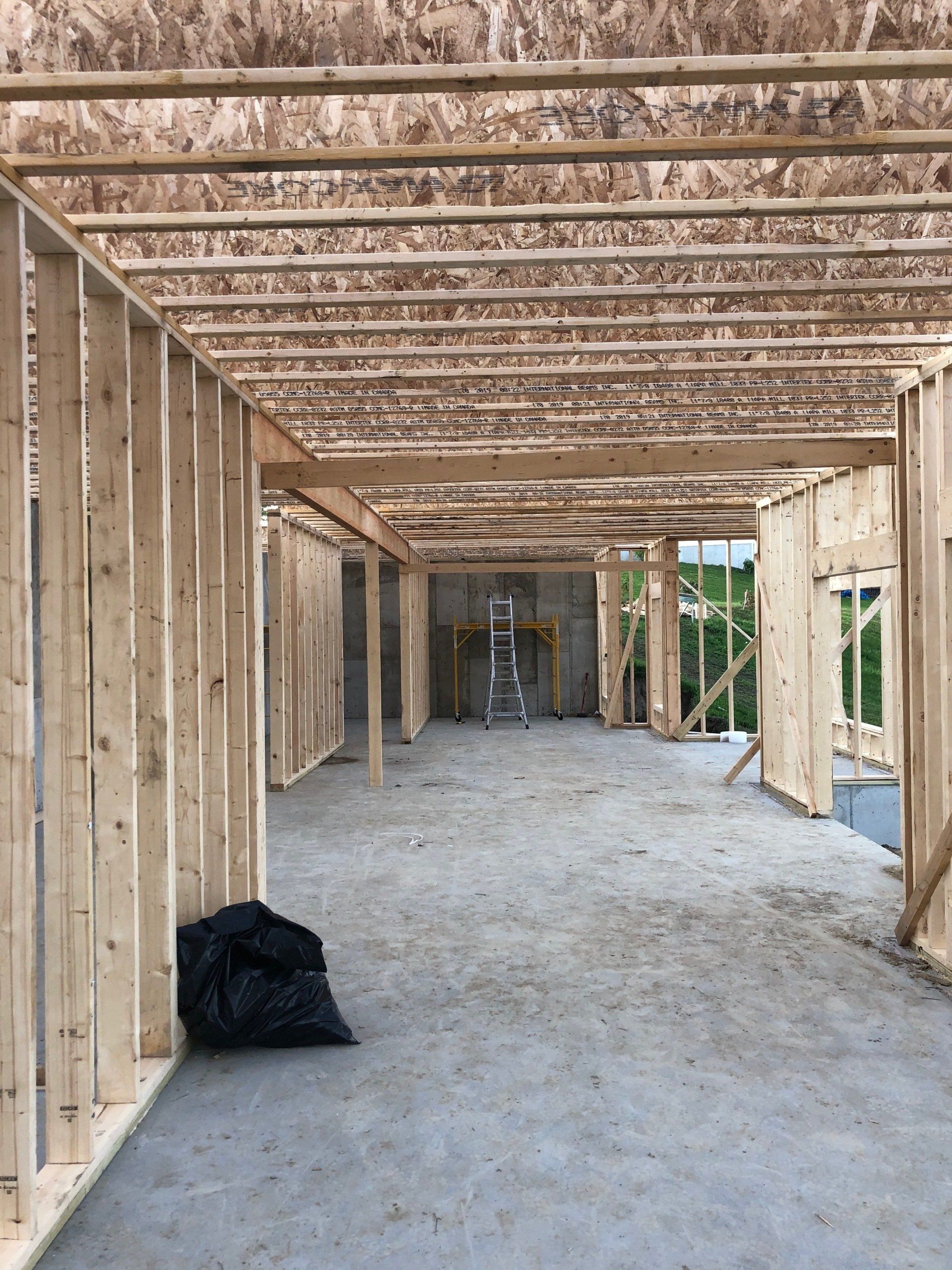 The inside of a building under construction with wooden beams
