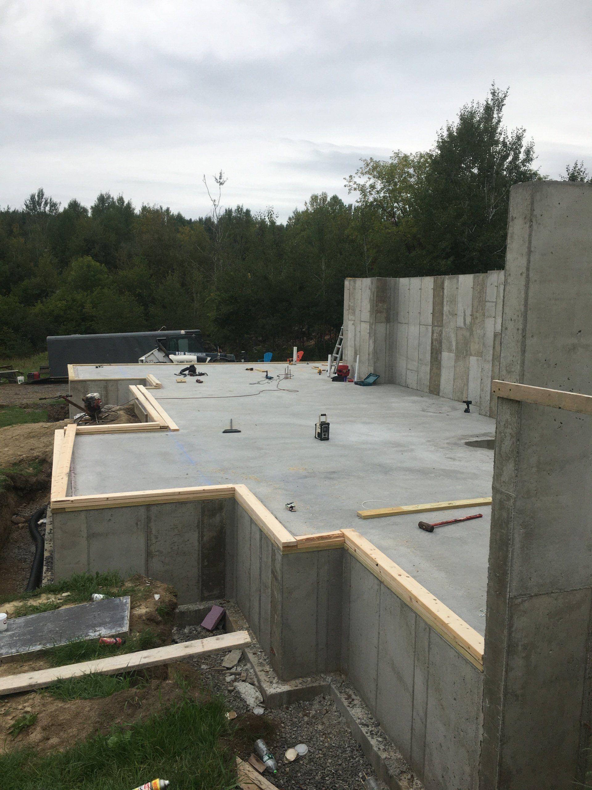 A concrete foundation of a house under construction