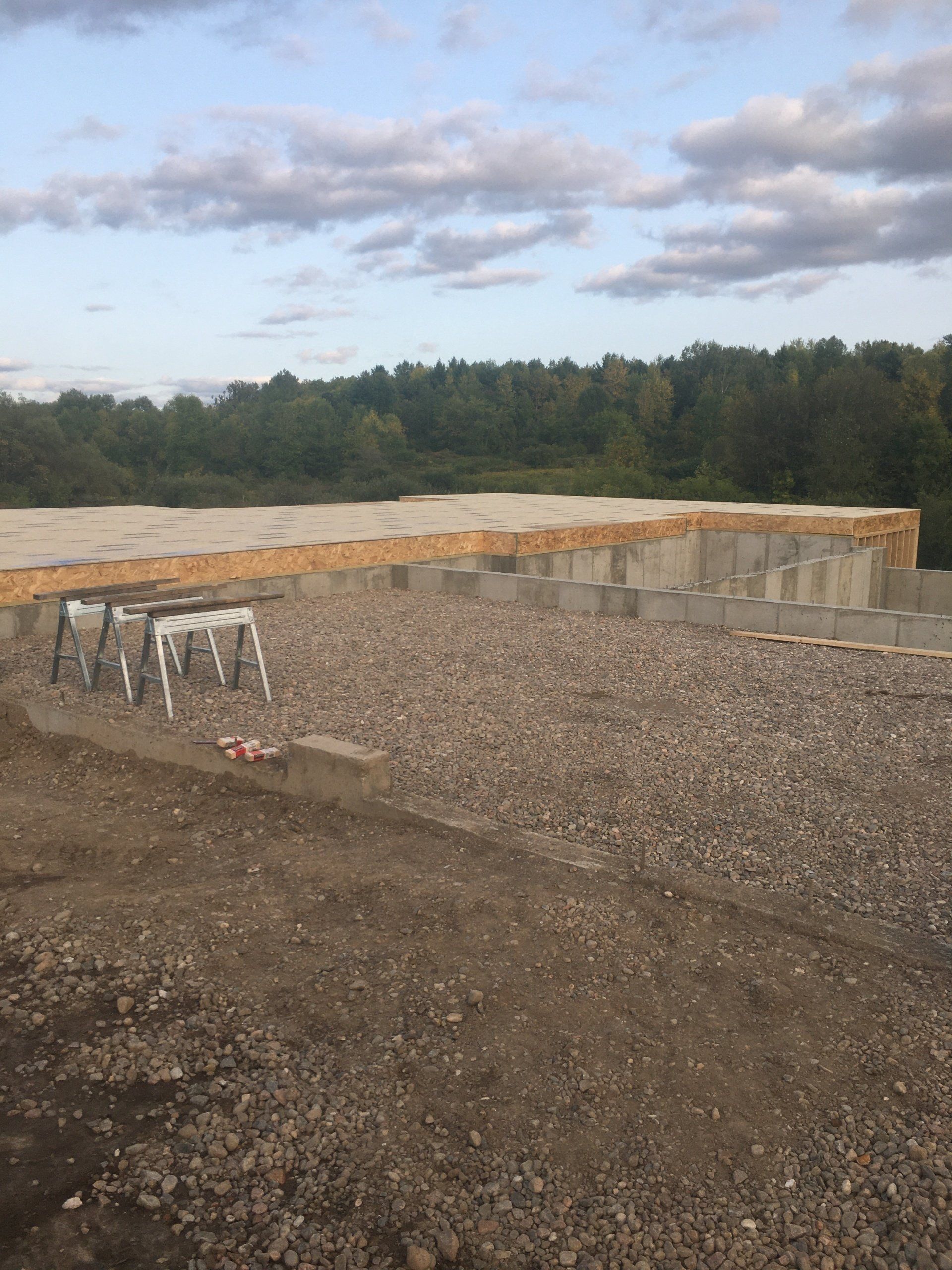 A construction site with a lot of gravel and bricks.