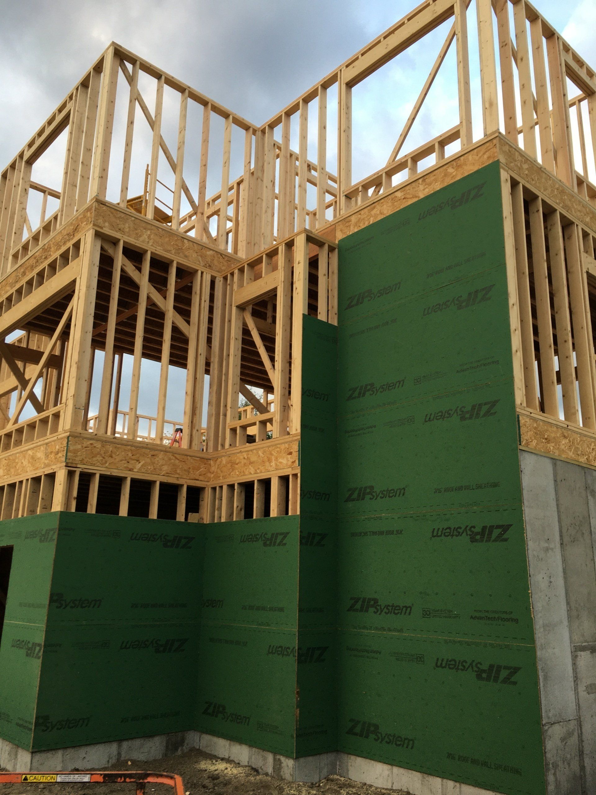 A house that is being built with green walls