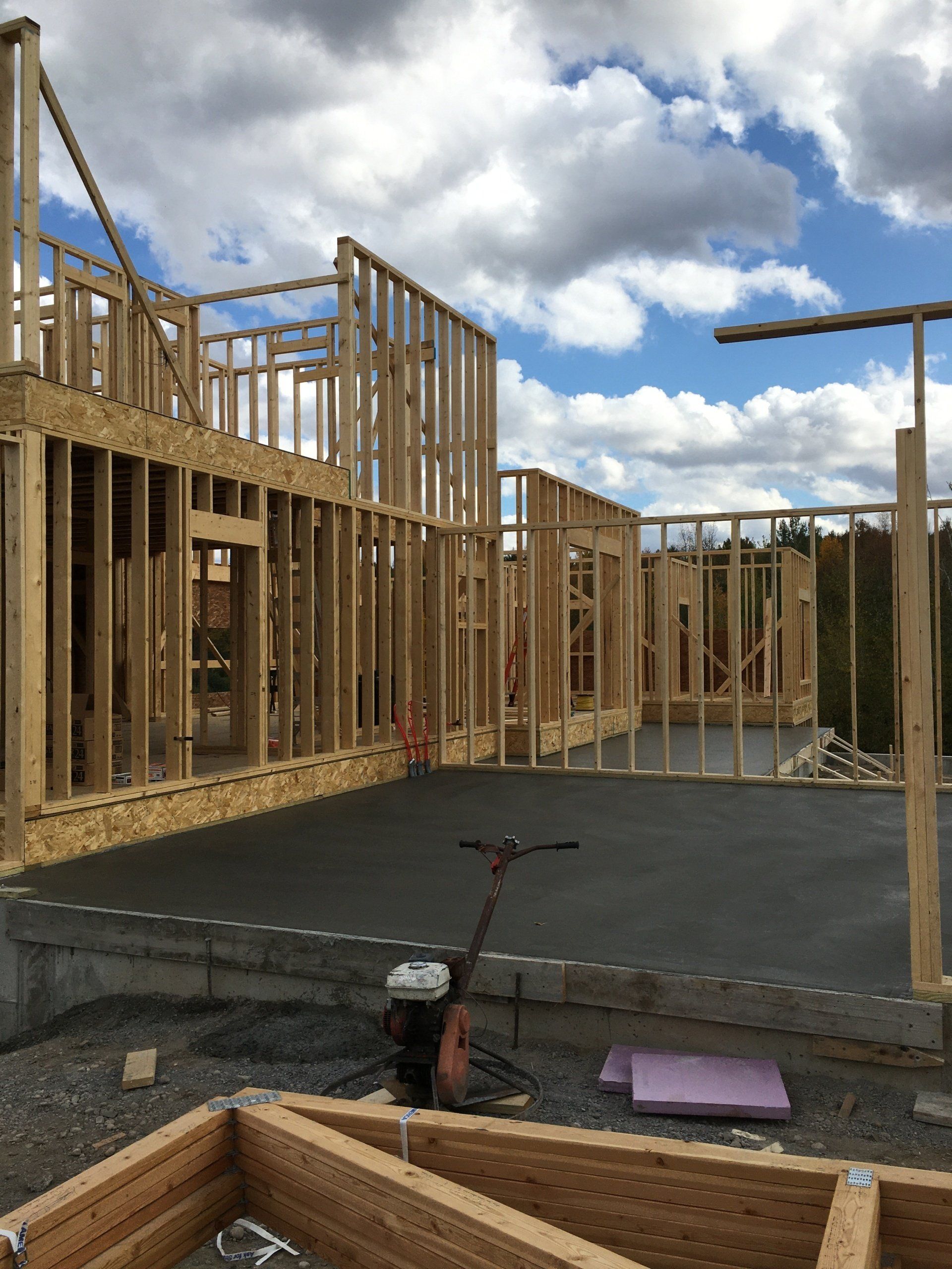 A house is being built with a lot of wooden frames