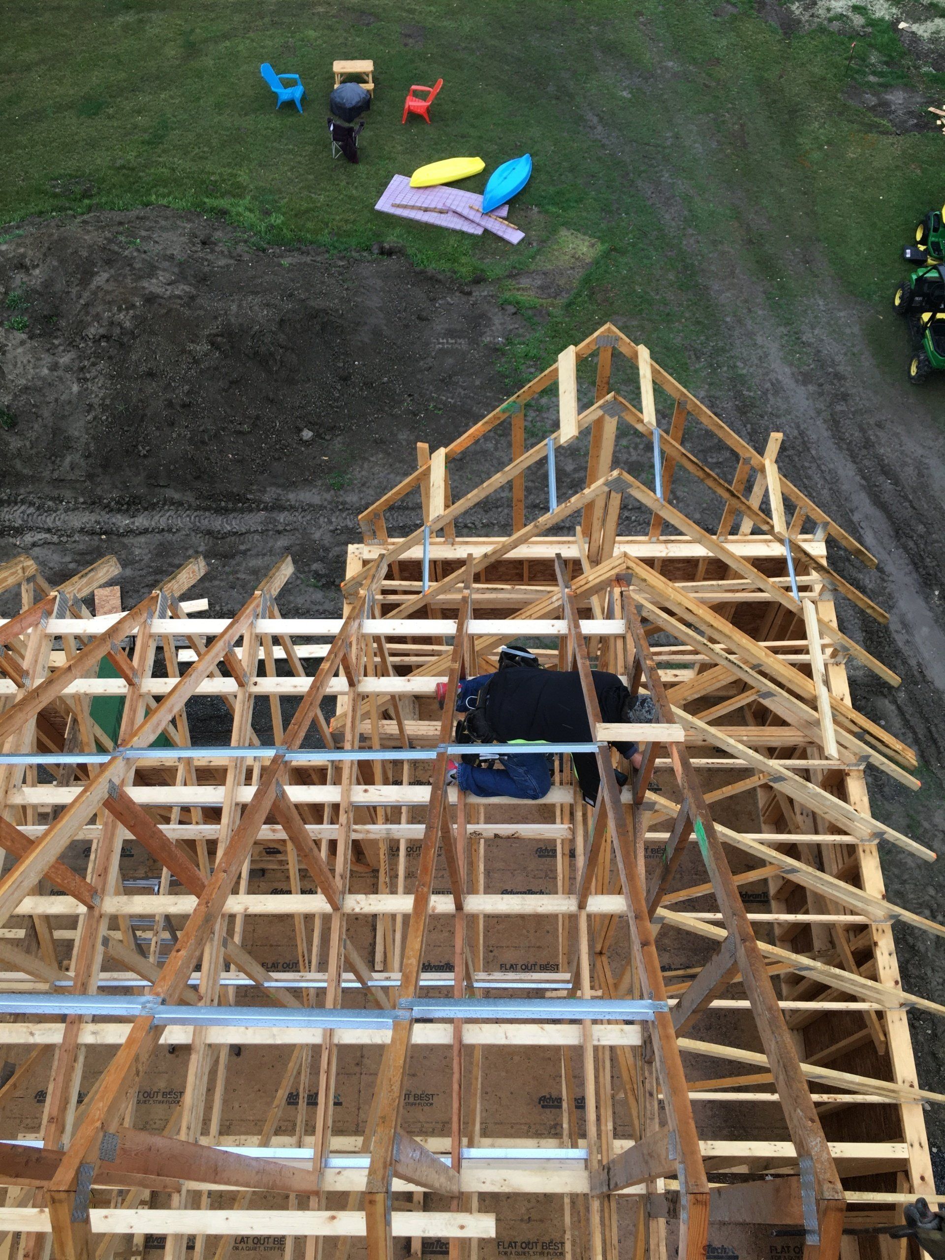An aerial view of a wooden structure under construction