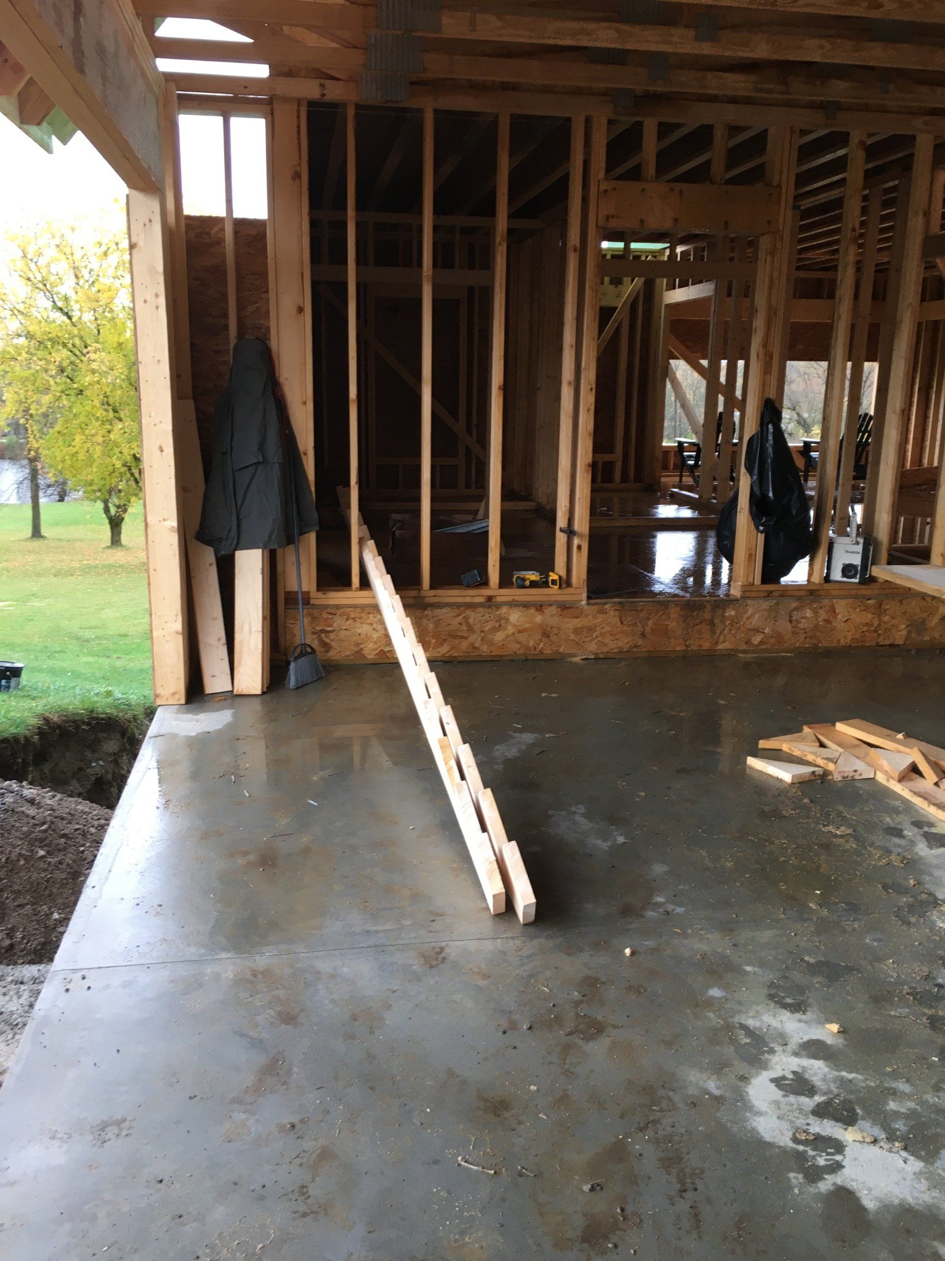 The inside of a building under construction with a concrete floor
