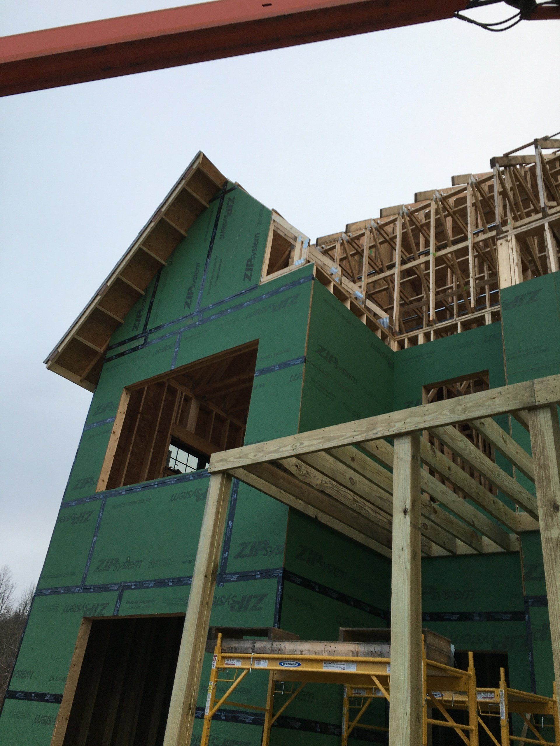 A house that is being built with green walls