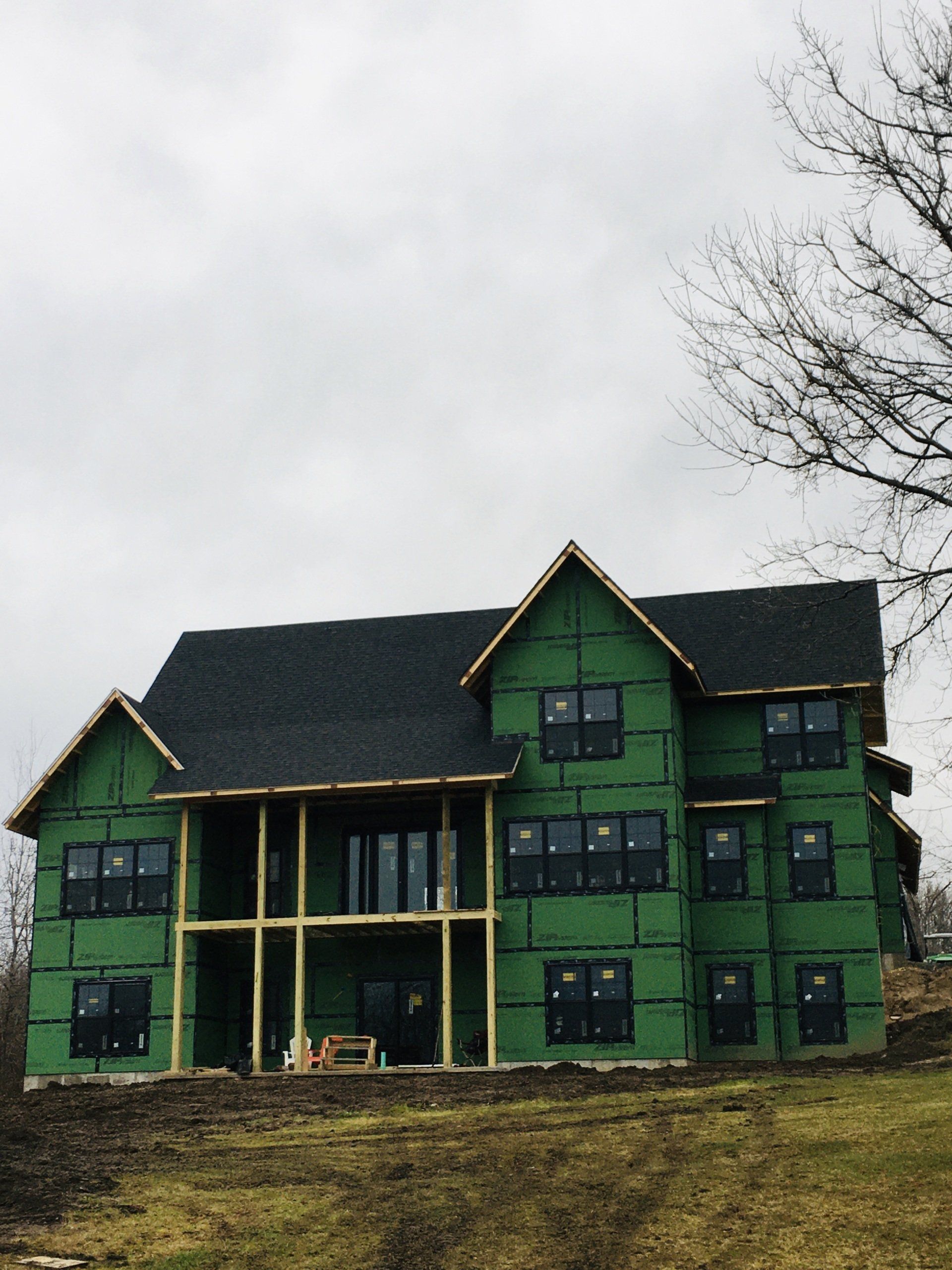A large house that is being built with green insulation