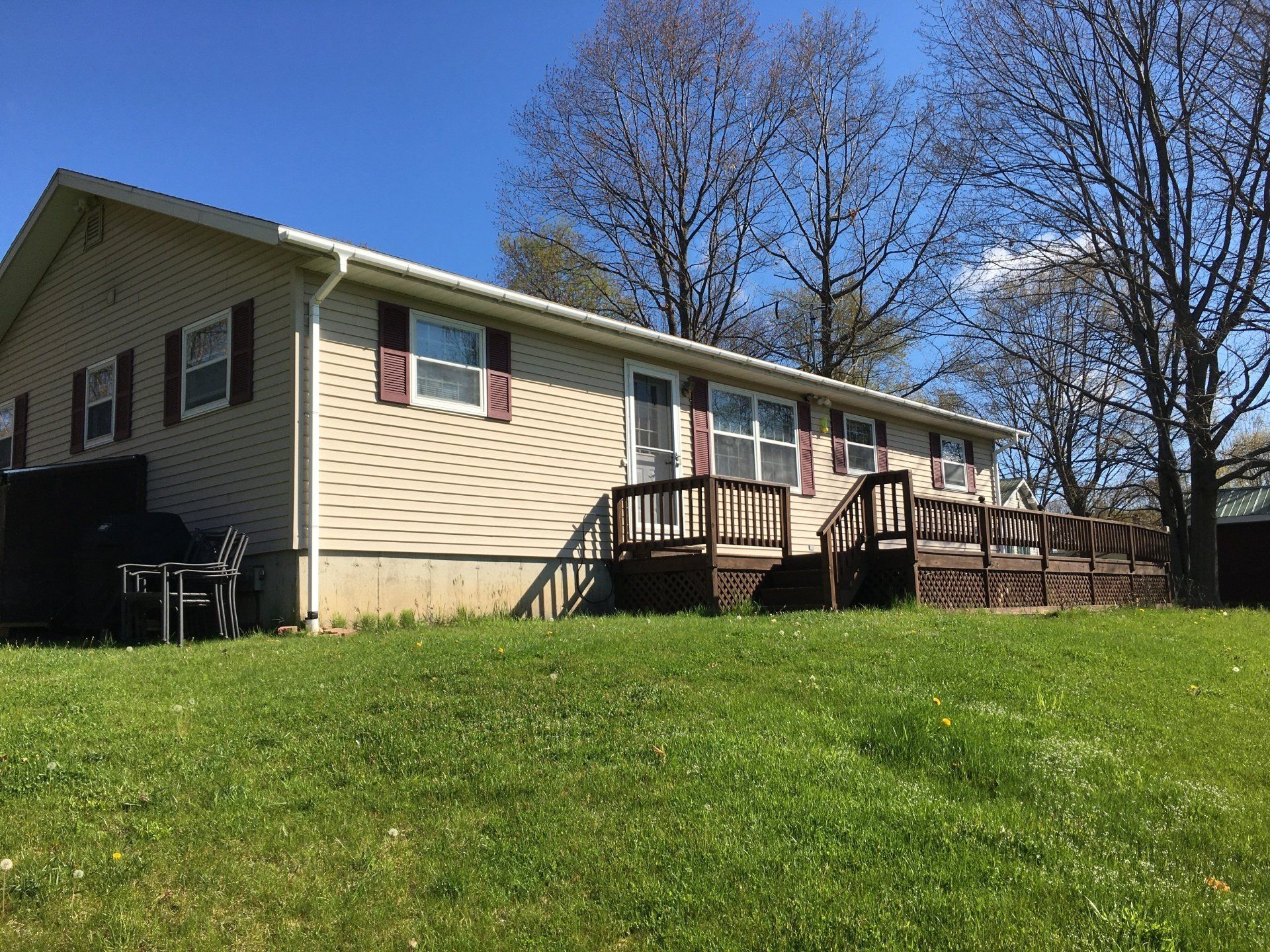 A large house with a large lawn in front of it.