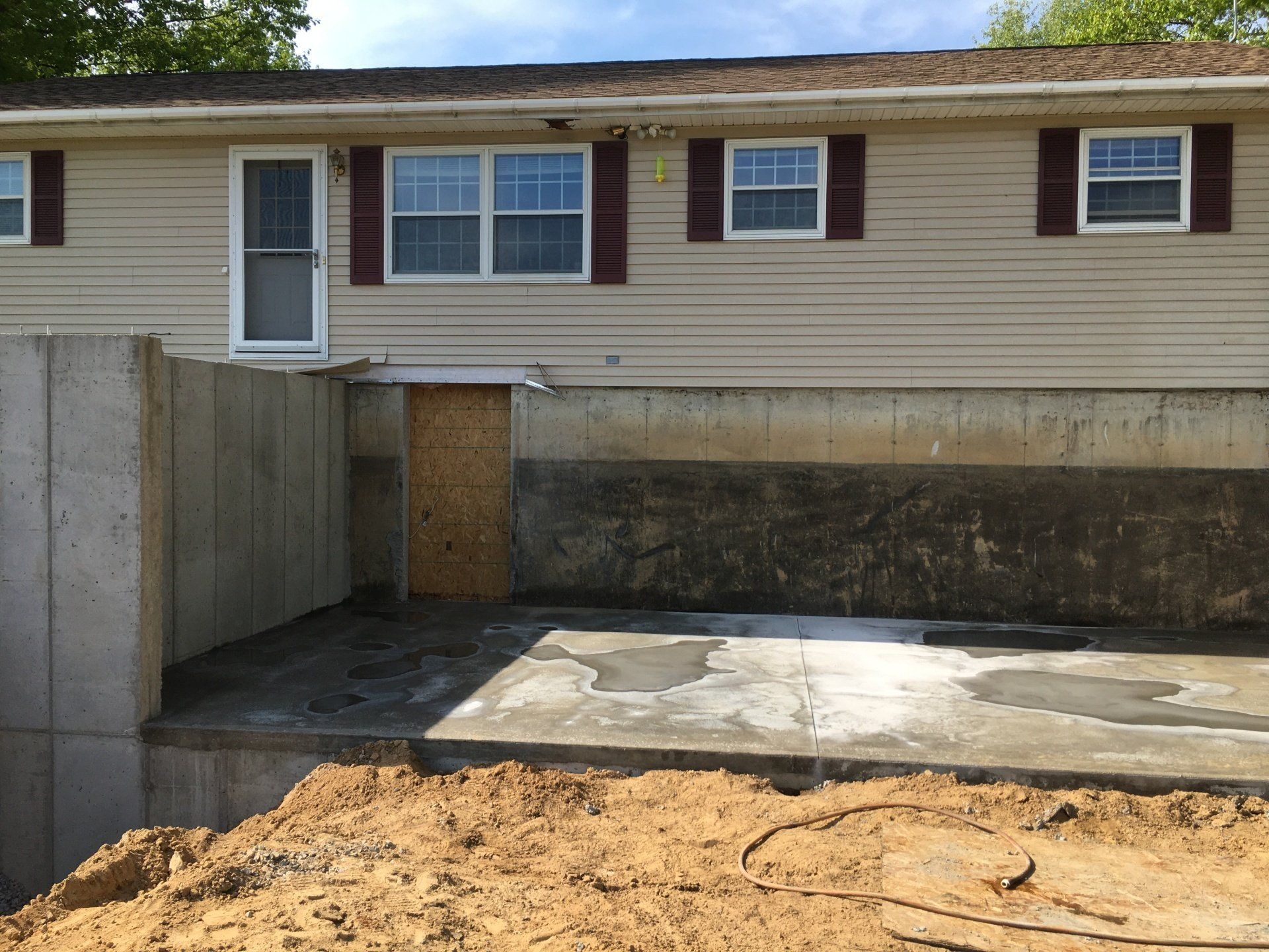 A house with a concrete basement underneath it