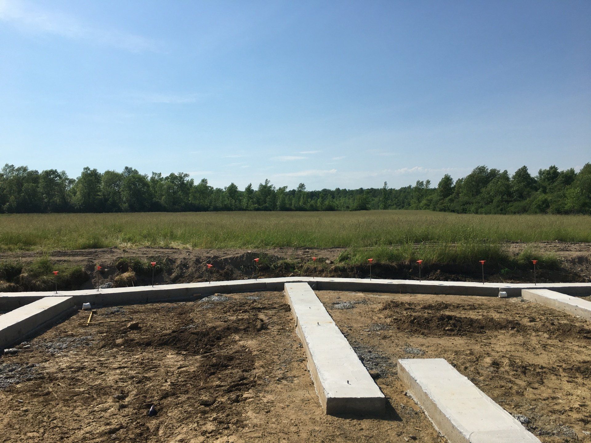 A construction site with a large field in the background