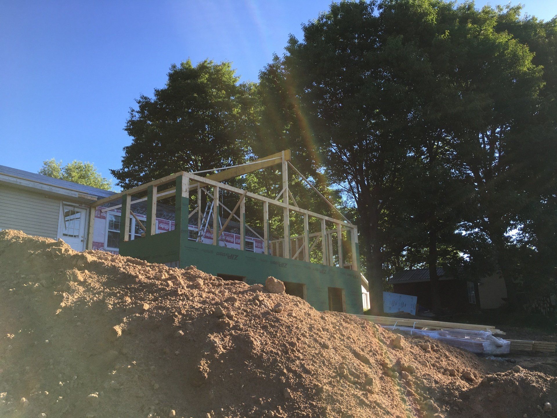 A house is being built on top of a pile of dirt