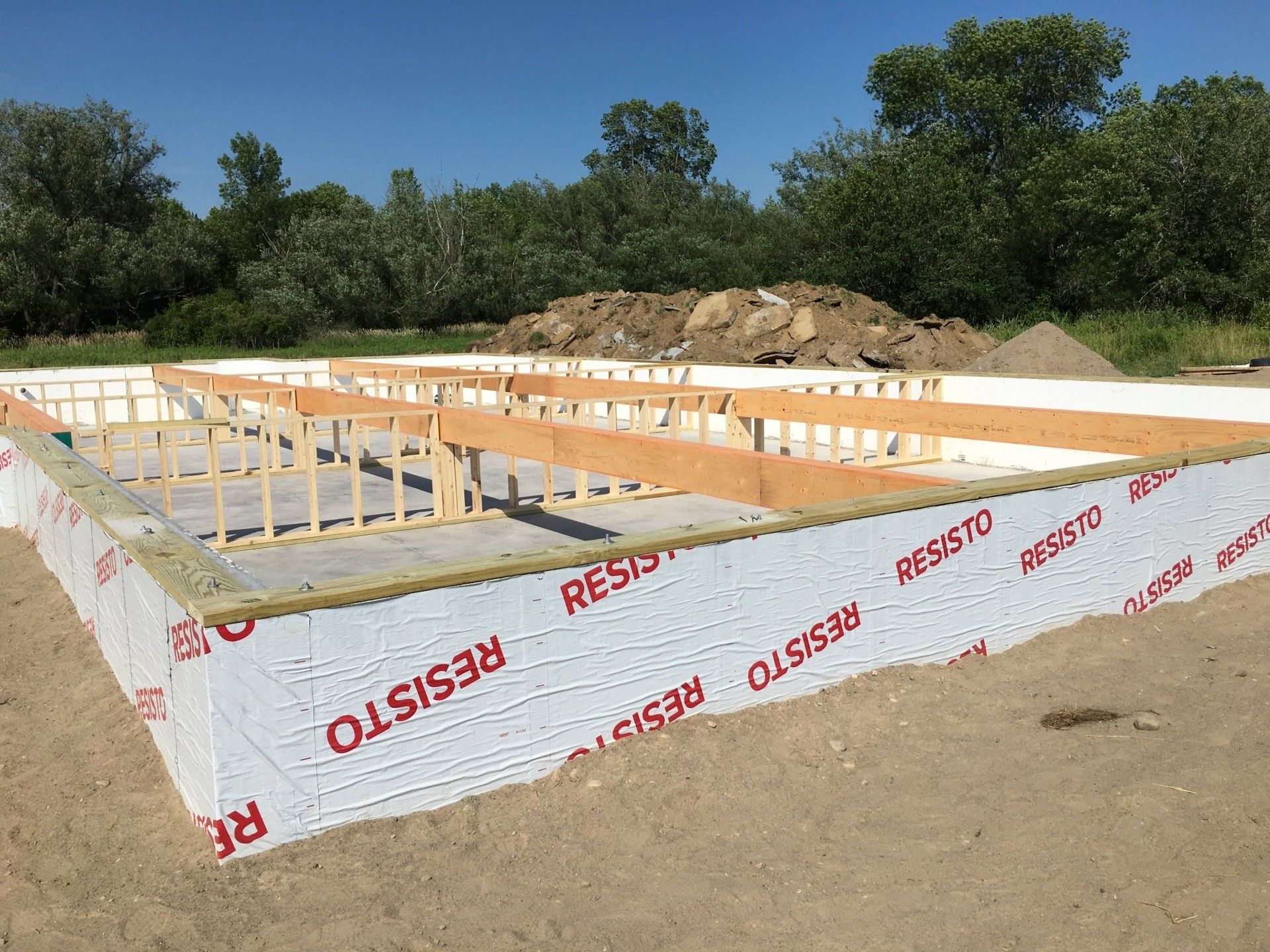 A foundation for a house is being built with resisto insulation