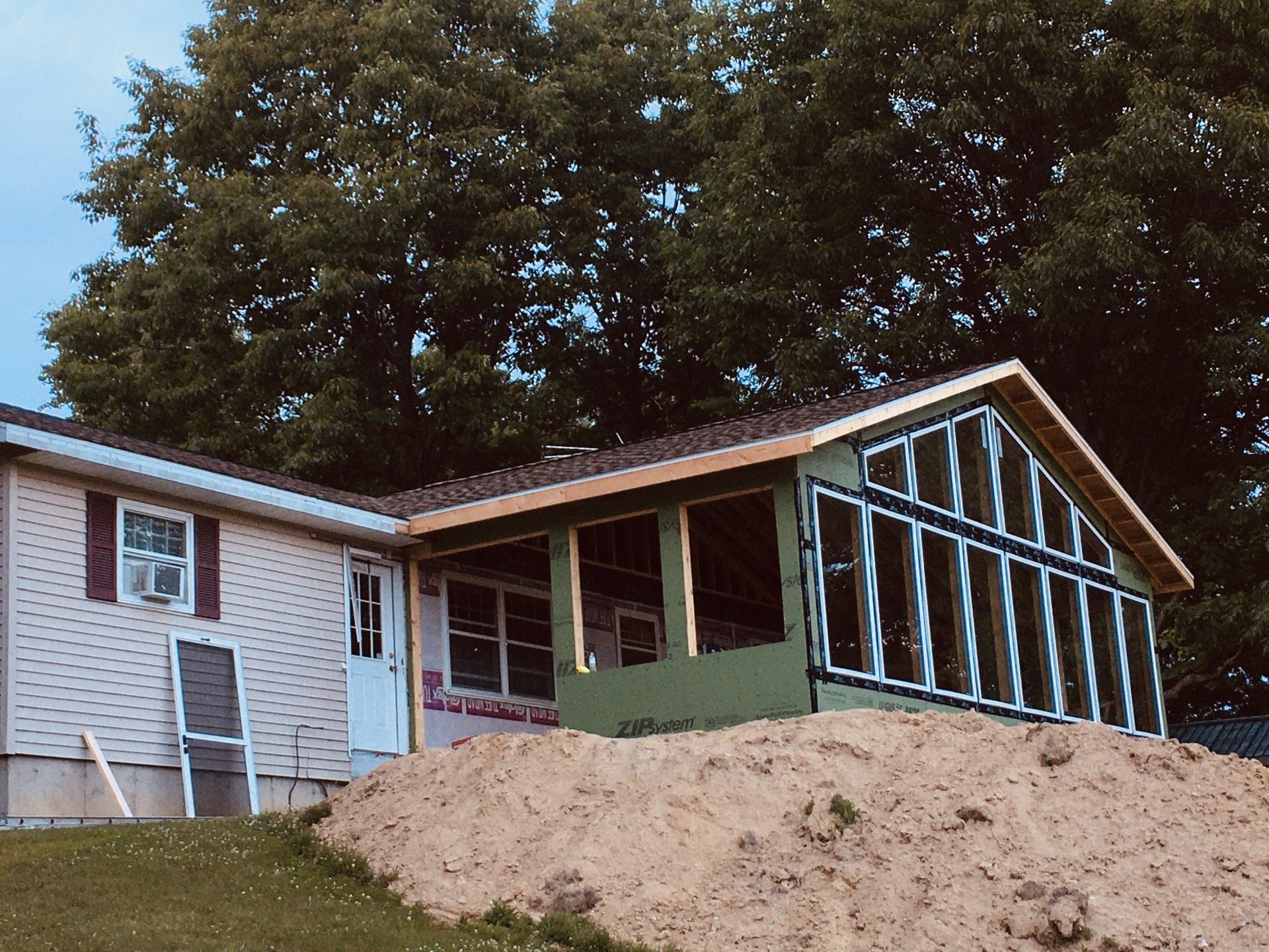 A house that is being remodeled with a green roof