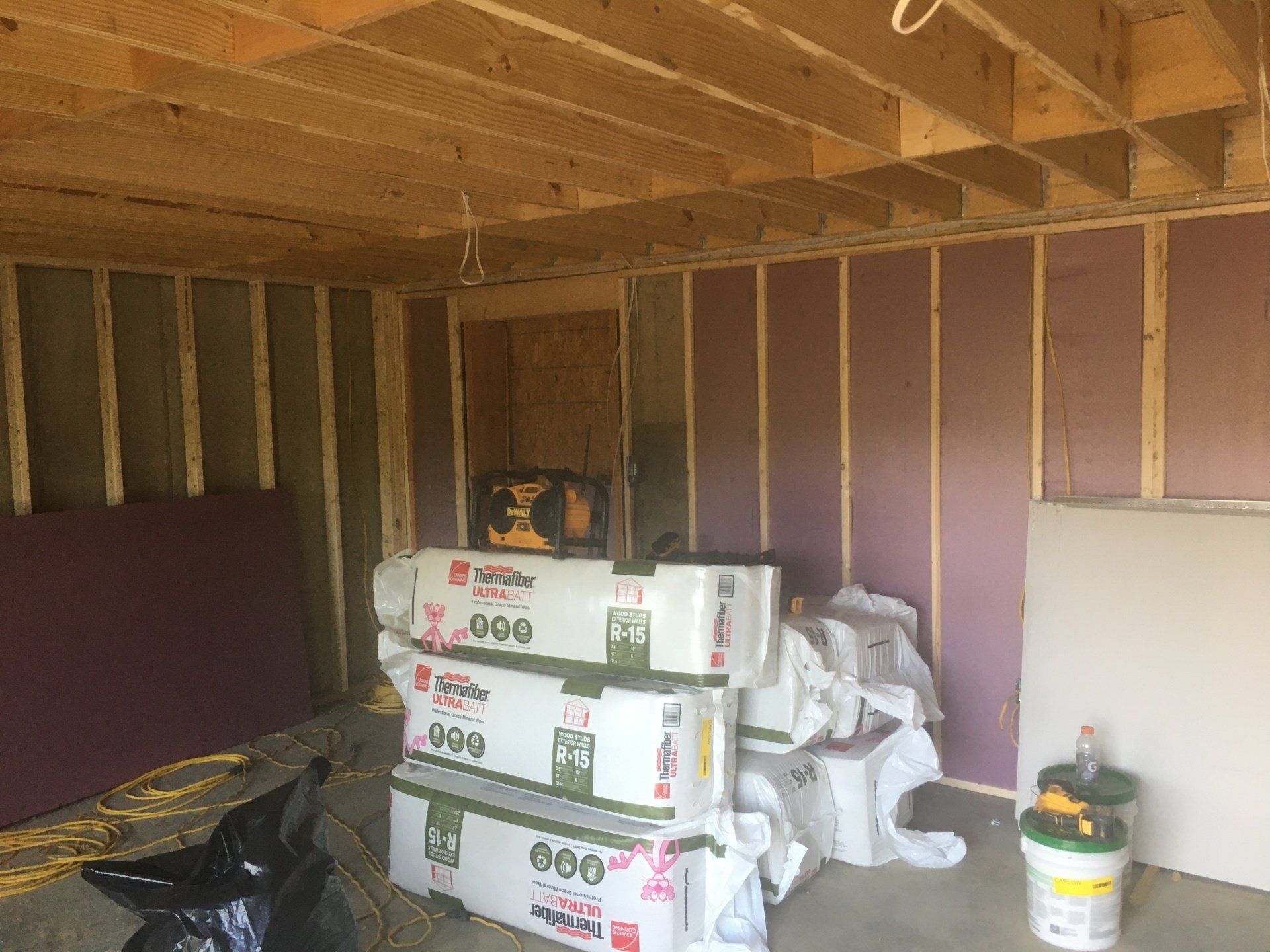 A room with a lot of boxes stacked on top of each other.