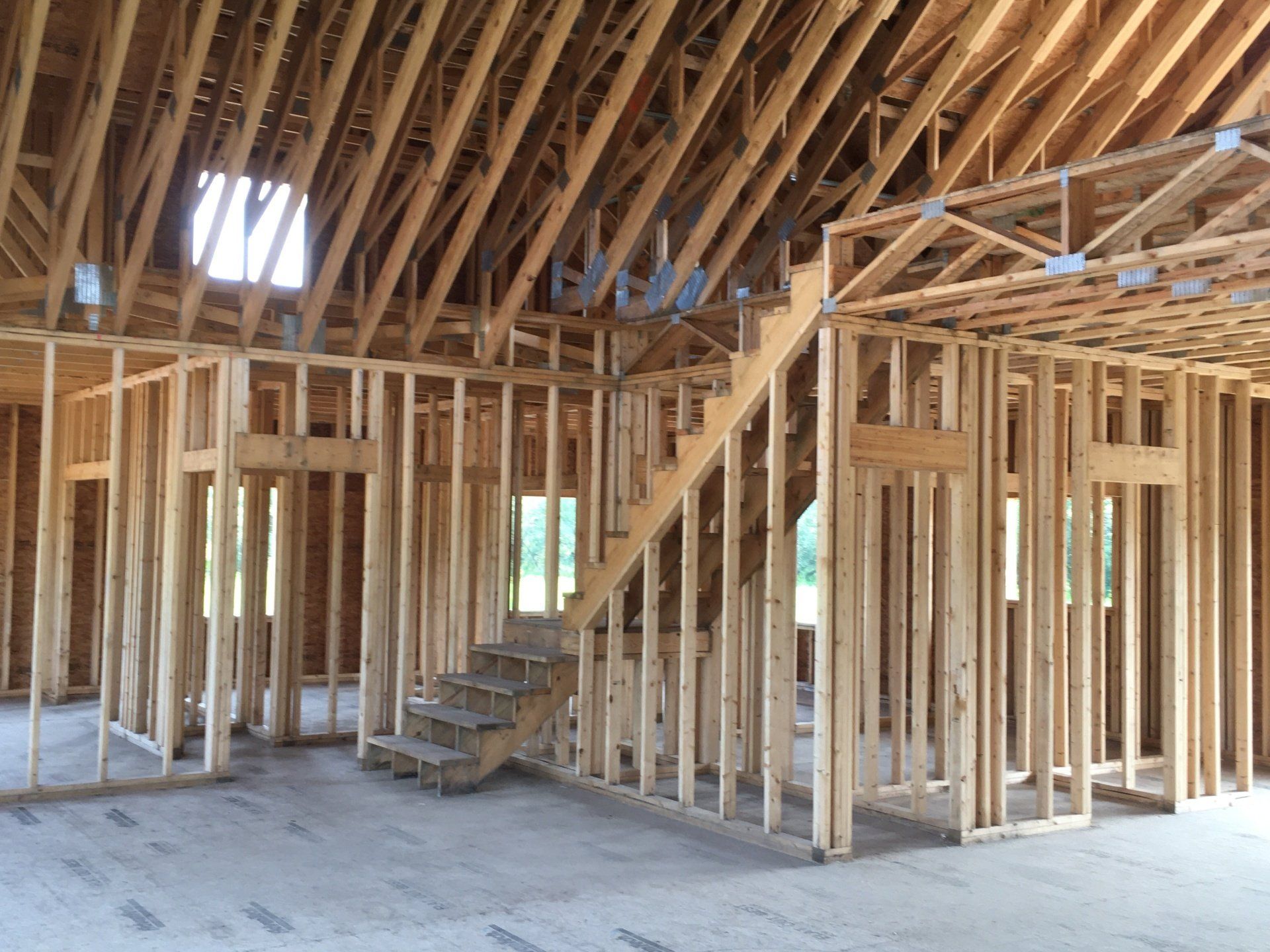 A house under construction with a staircase in the middle