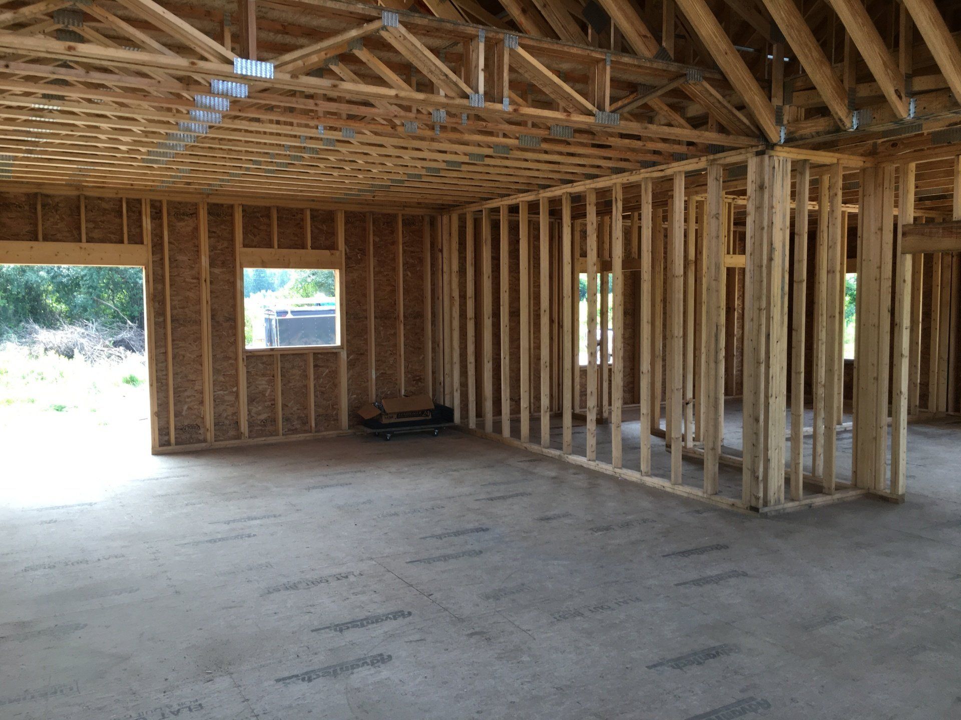 An empty room with a wooden frame and a window