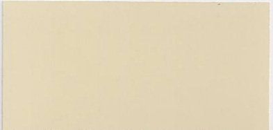 A close up of a piece of white paper on a white surface.