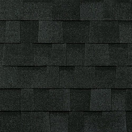 A close up of a row of black shingles on a roof.