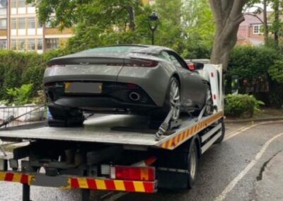 A car is being towed by a tow truck.