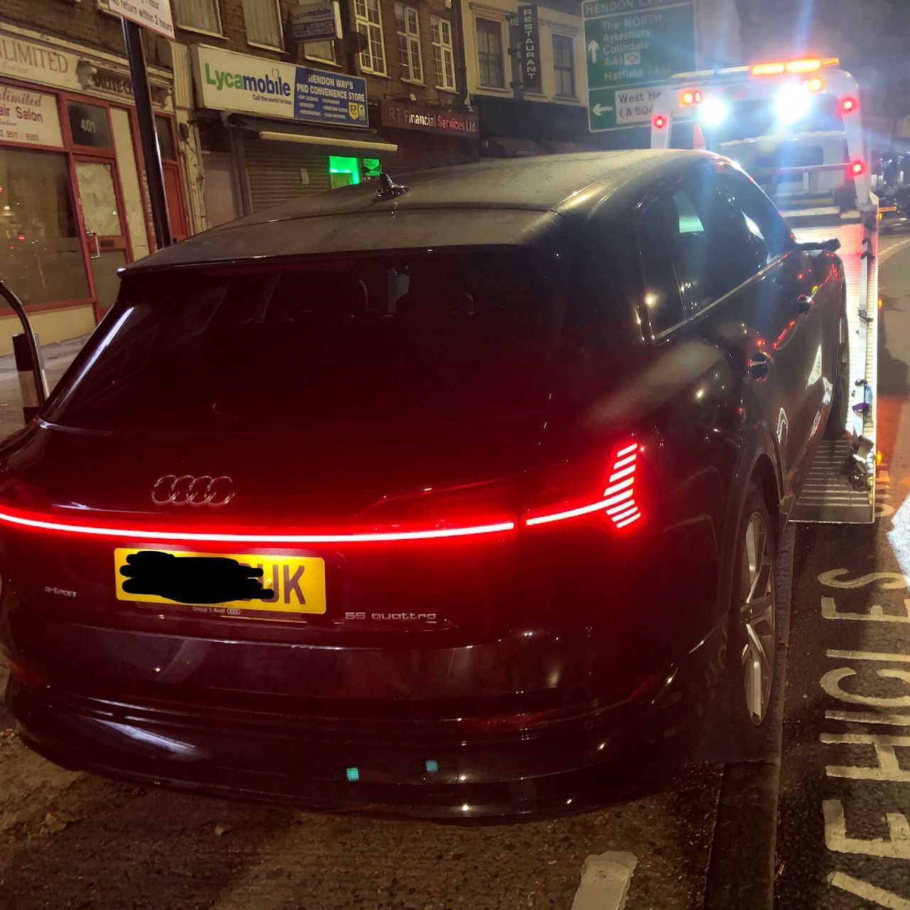 A black car with a license plate that says uk