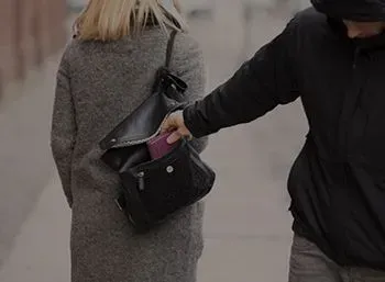 A Man Is Stealing A Wallet From A Woman 's Purse — Pleasanton, CA — Thompson • Garcia Law