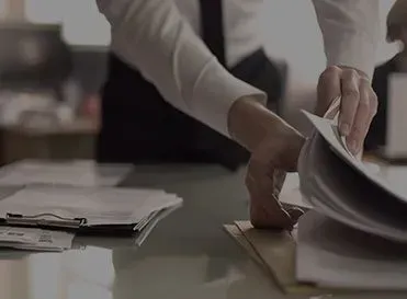 A Person Is Holding A Piece Of Paper Over A Clipboard — Pleasanton, CA — Thompson • Garcia Law