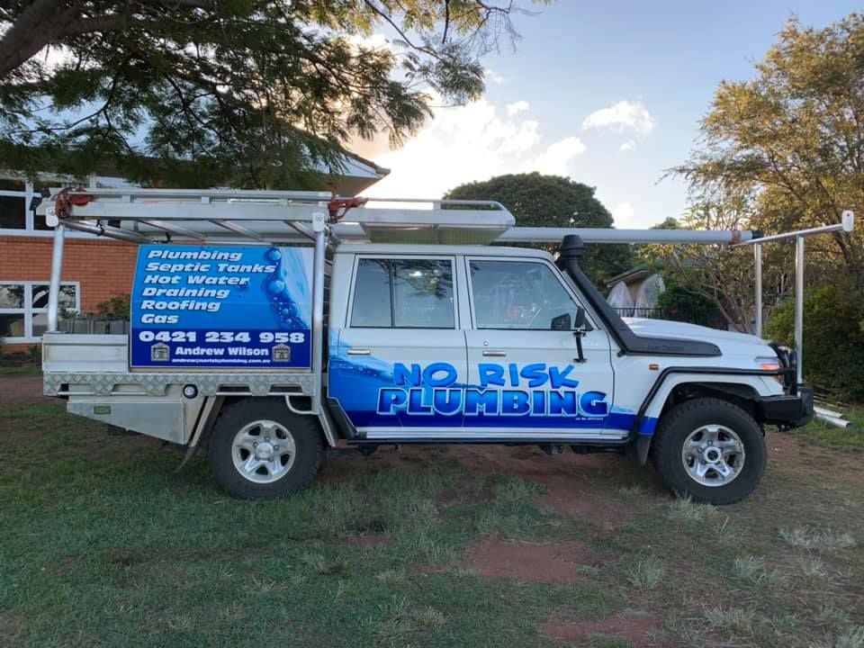 A no risk plumbing truck is parked in front of a house  — No Risk Plumbing Kyogle Pty Ltd in Geneva, NSW