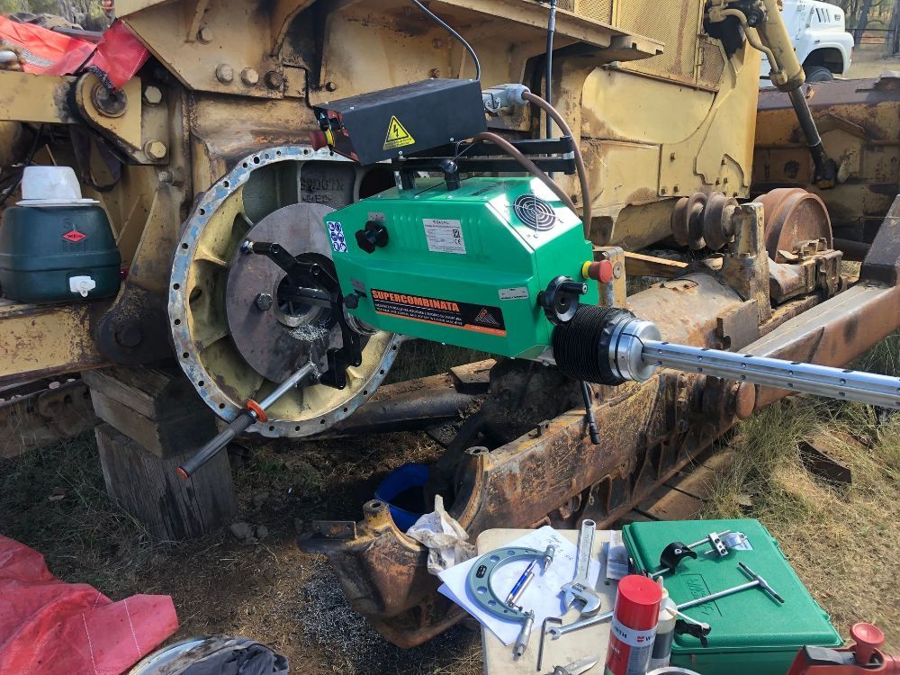 A Green Machine Is Sitting On Top Of A Yellow Vehicle — McLaren Engineering in Atherton, QLD