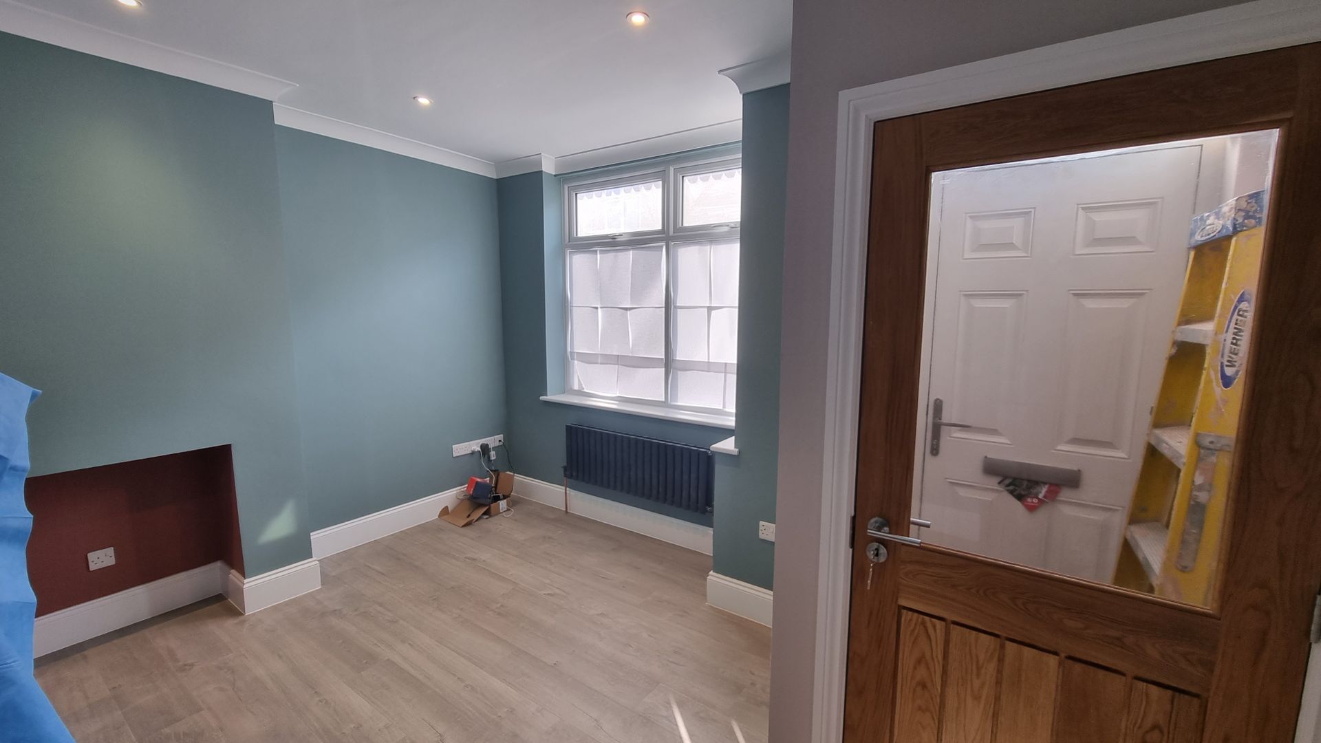 Refurbished room with pale blue walls, white ceiling and woodwork in York.