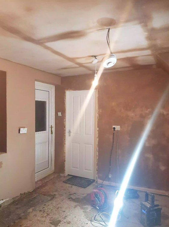 Room under renovation with newly plastered walls in York.