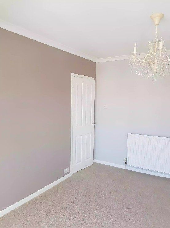 Renovated room with soft grey feature wall in York.