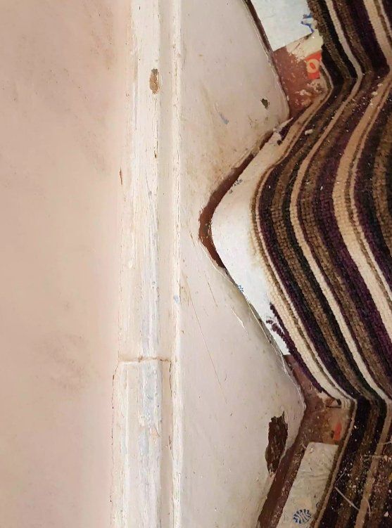 Close-up of a wall corner showing plastering work and preparation for painting in York.