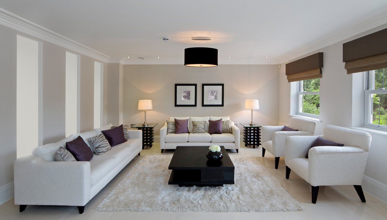 Spacious living room with neutral tones, large windows, and modern furniture in York.