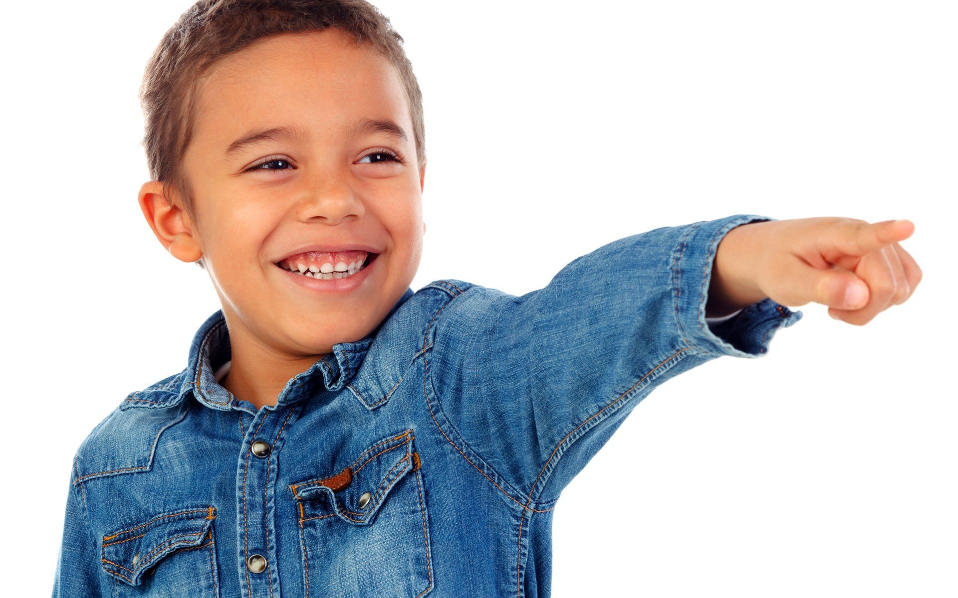 Young boy smiling and pointing