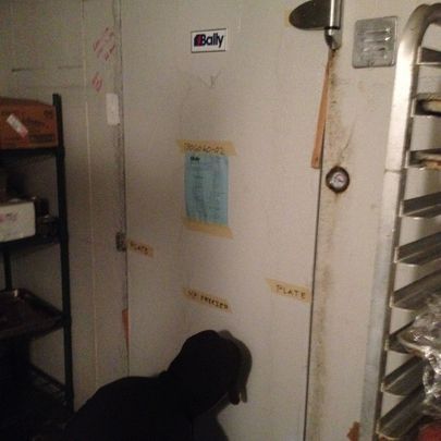 A white door with a poly sticker on it