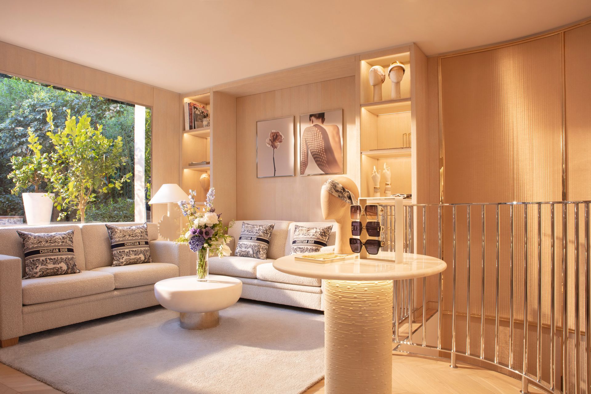 A living room with a couch , table , and window.