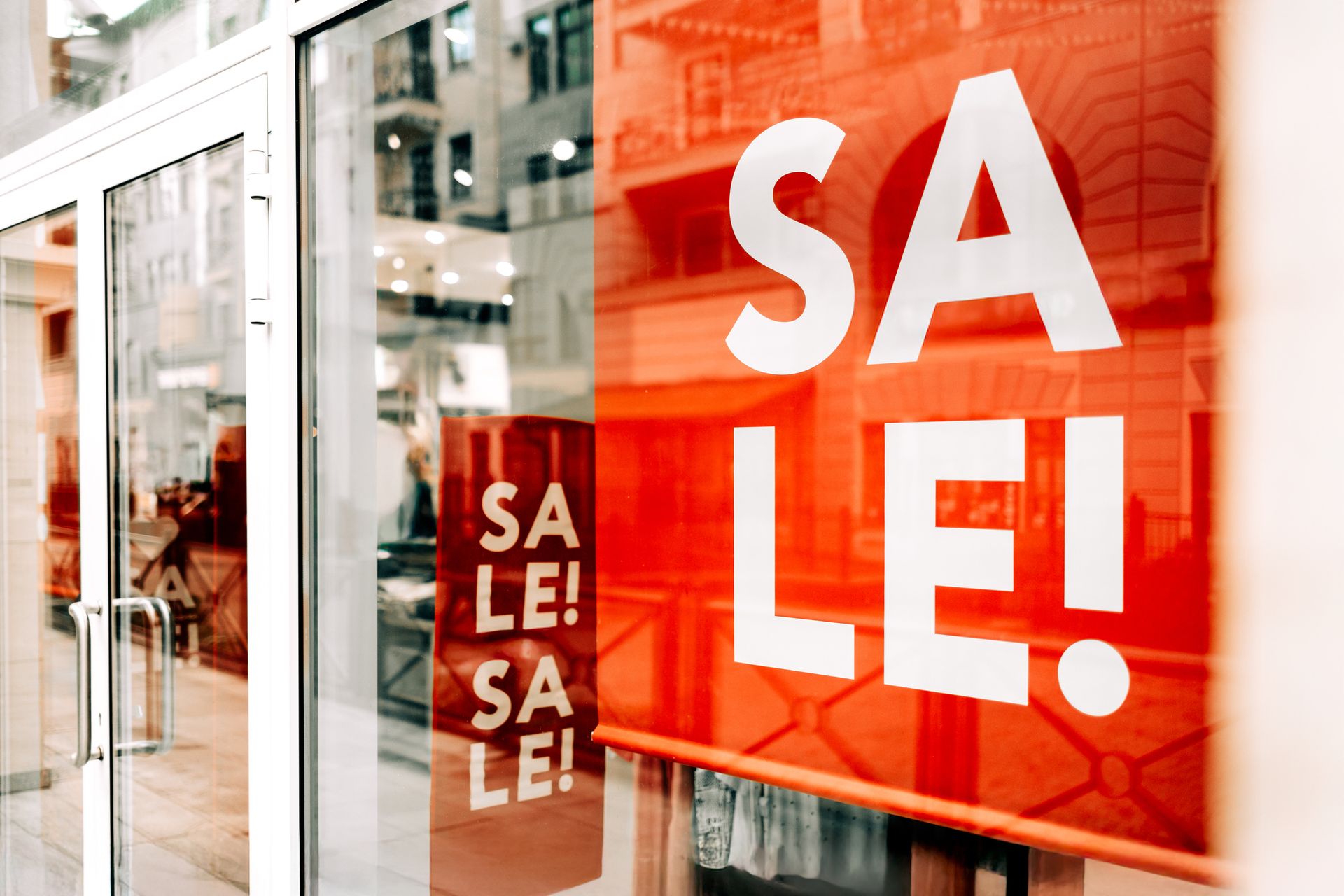 Print Storm store exterior with colorful window graphics. Building with black trim and a sign that reads