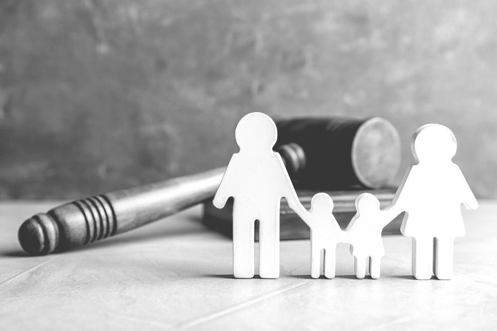 Two Broken Golden Wedding Rings Kept On A Divorce Decree Document — Farrell Lusher Solicitors In Wagga Wagga, NSW