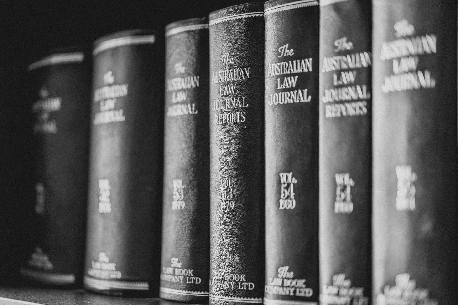 Row of Black Coloured Books Titled As