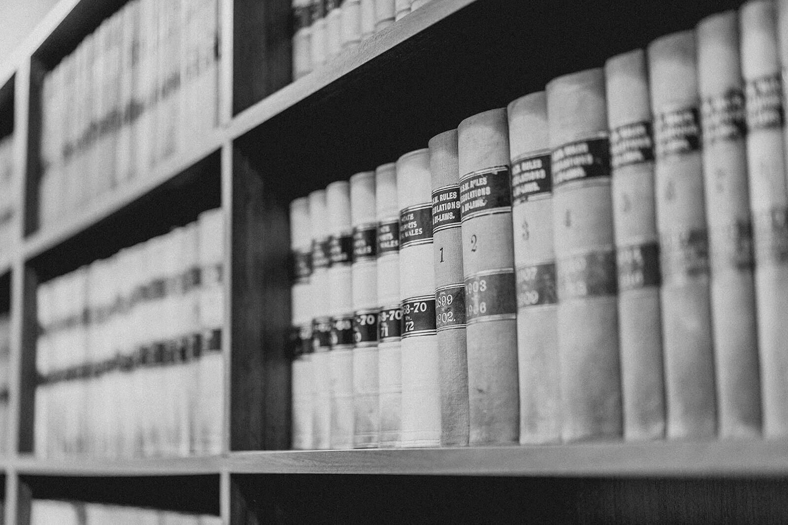 Black And White Photo of Law Books Saying Rules and Regulations — Litigation in Wagga Wagga