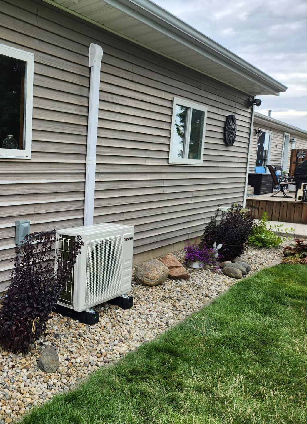 A wooden fence with a gate attached to it.