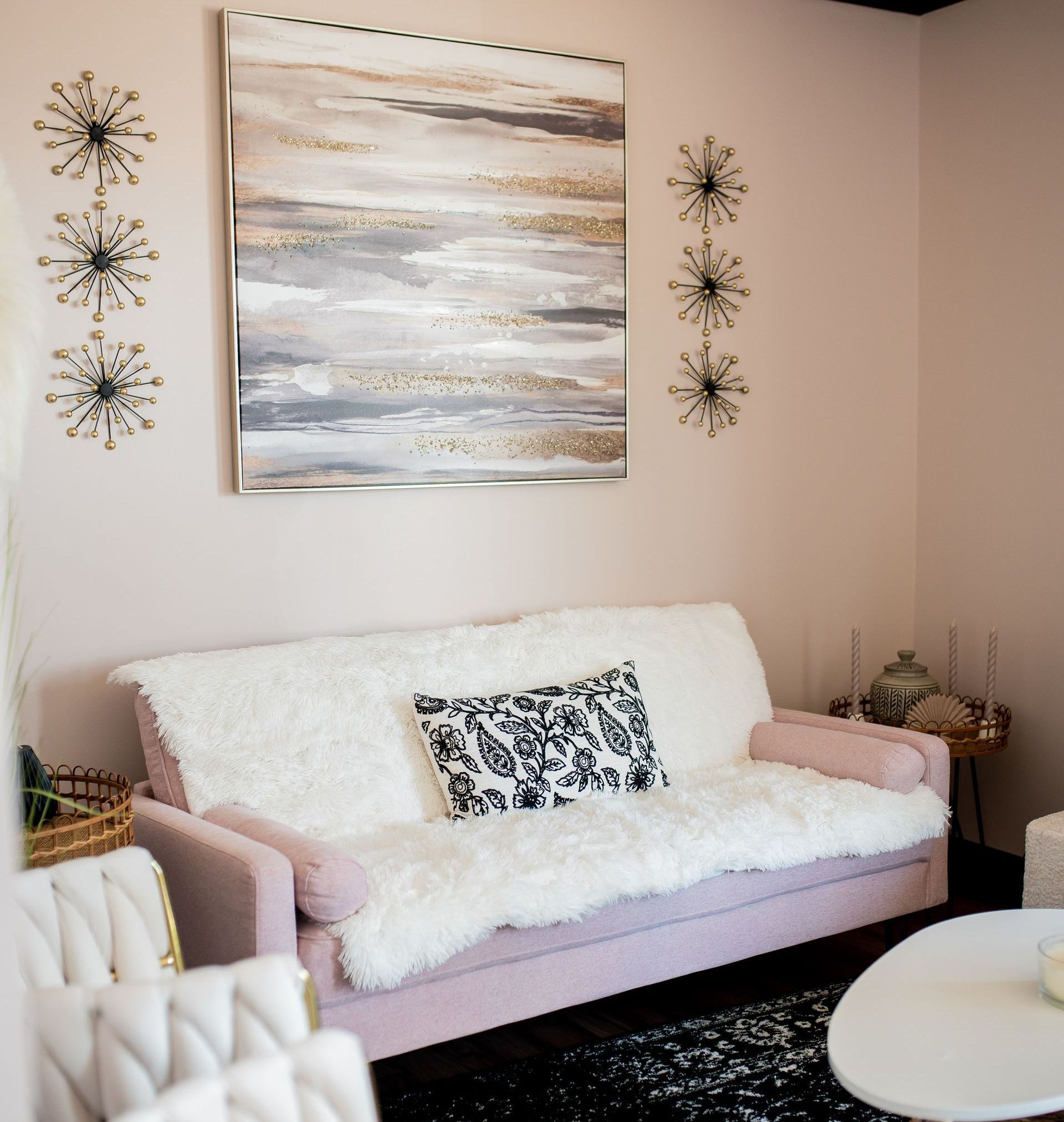 A white pumpkin is sitting on a table next to a flower and a card.