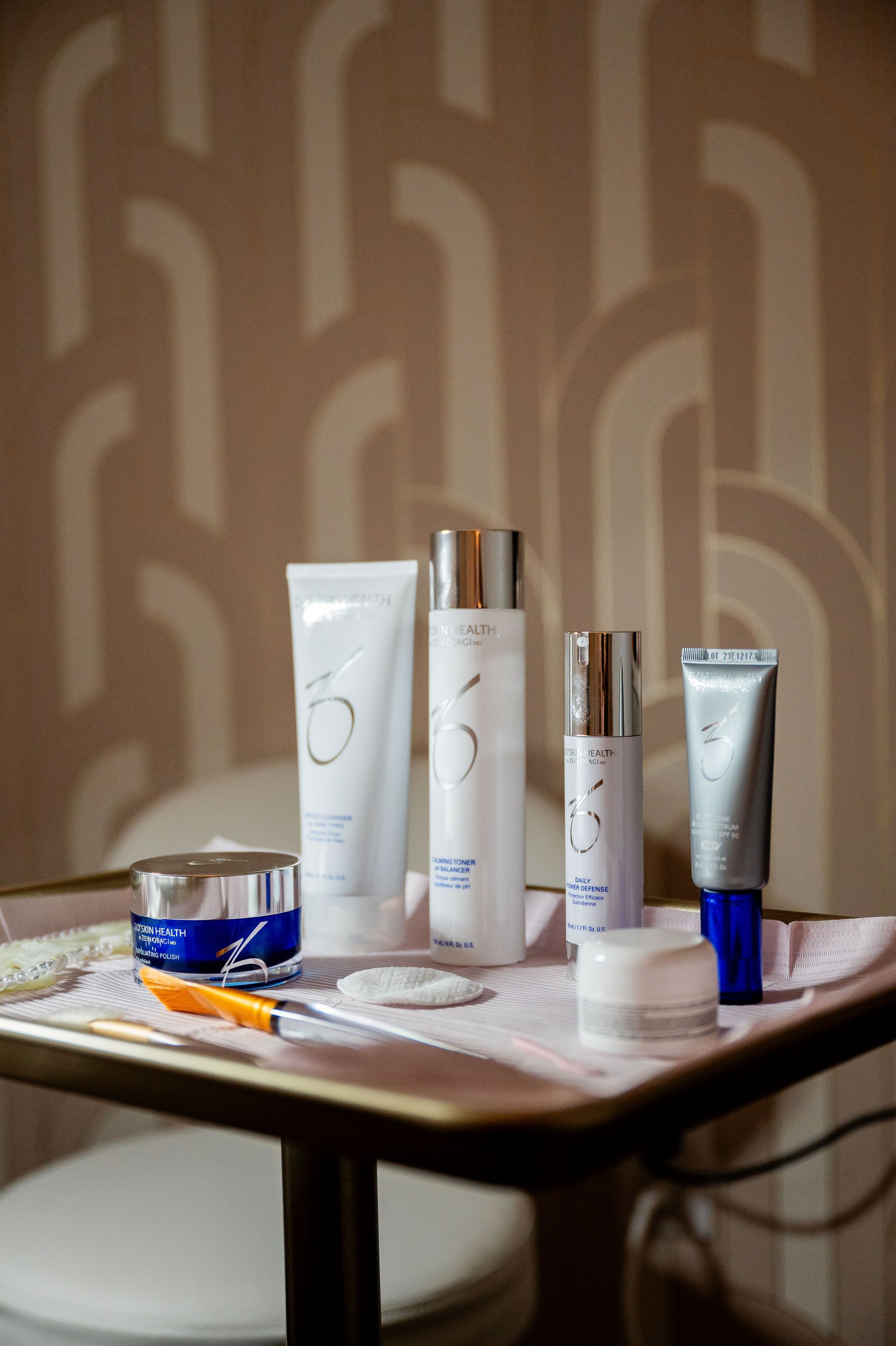 A table with a variety of cosmetics on it.