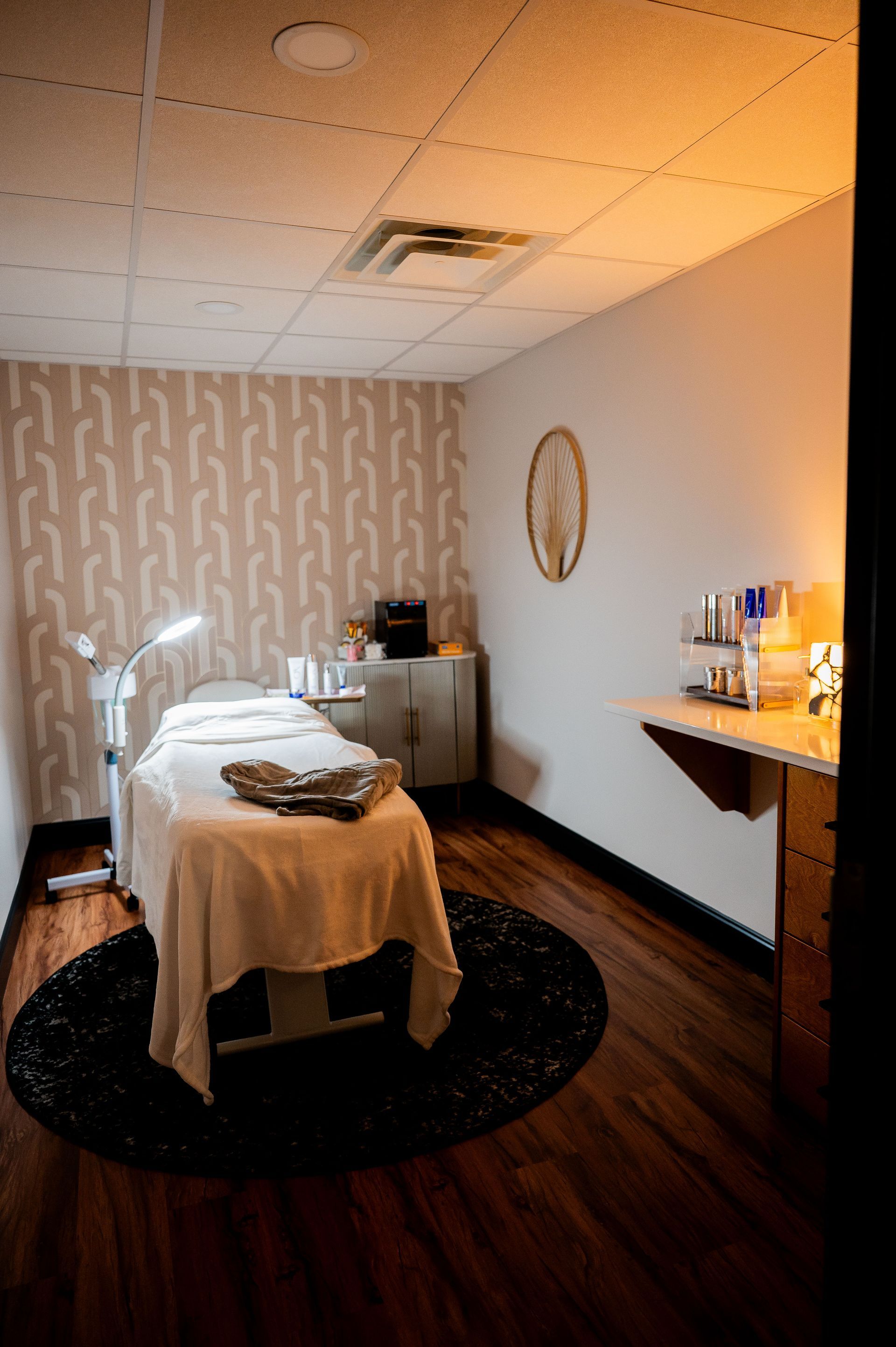 There is a massage table in the middle of the room.