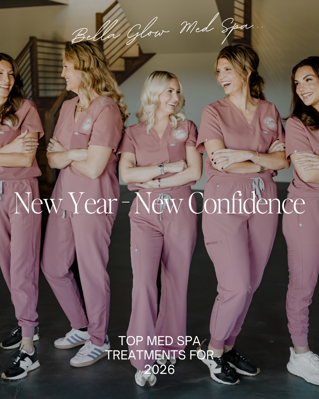 Five women in pink scrubs, arms crossed, smiling.