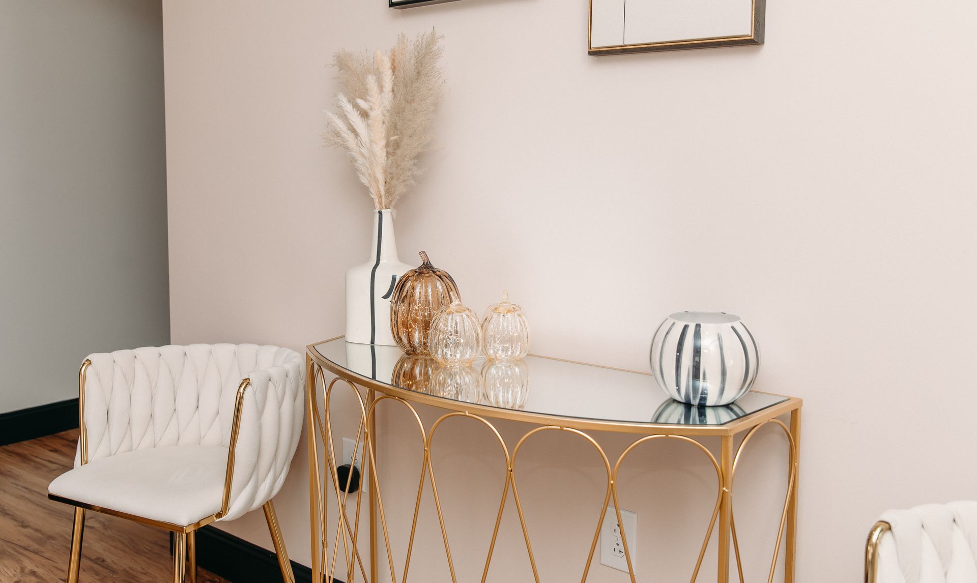 There is a chair and a table in the room.