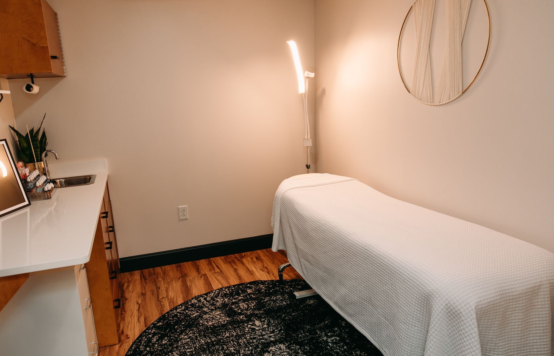 There is a massage table in the middle of the room.