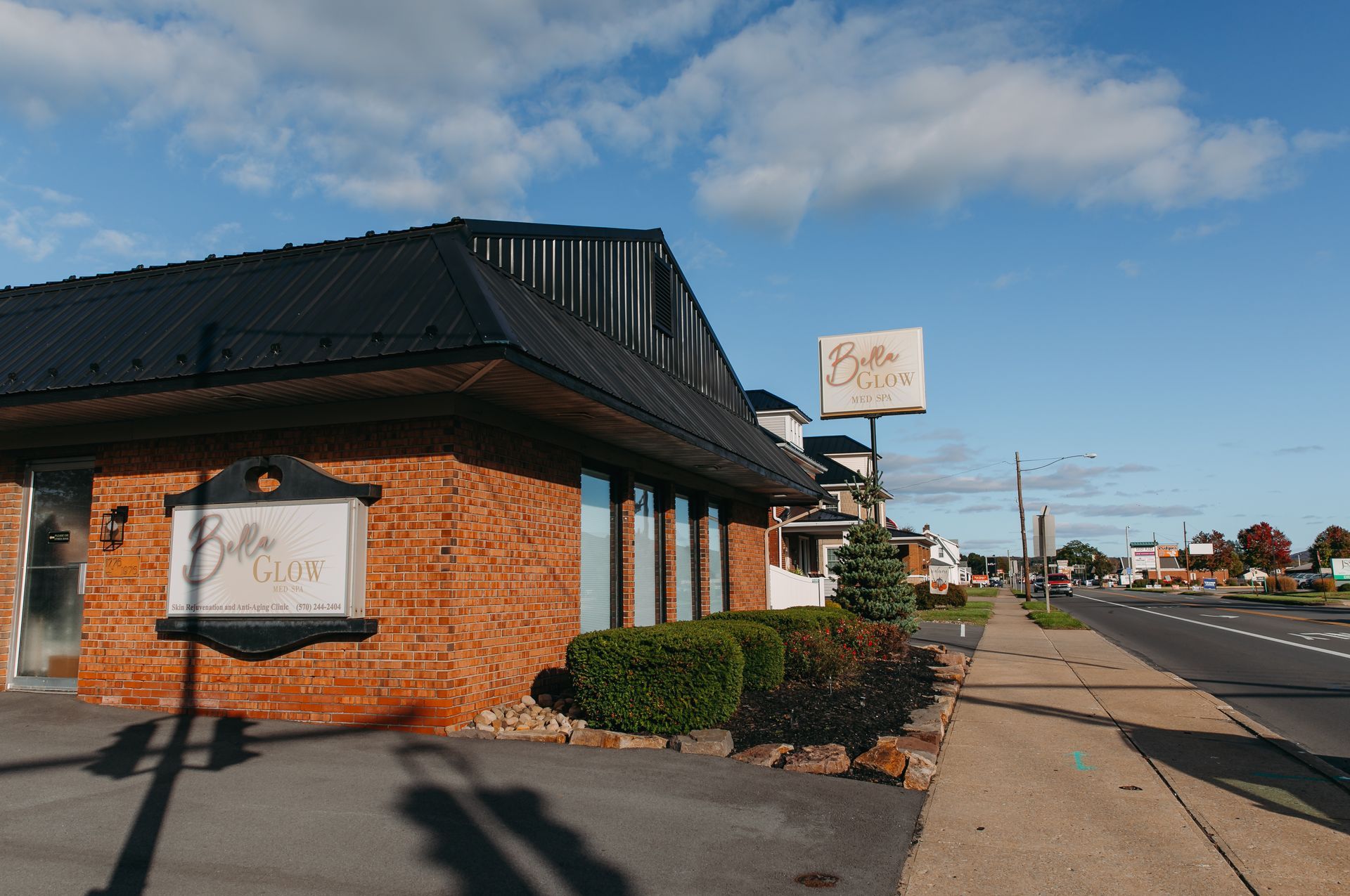 A brick building with a sign that says belle on it