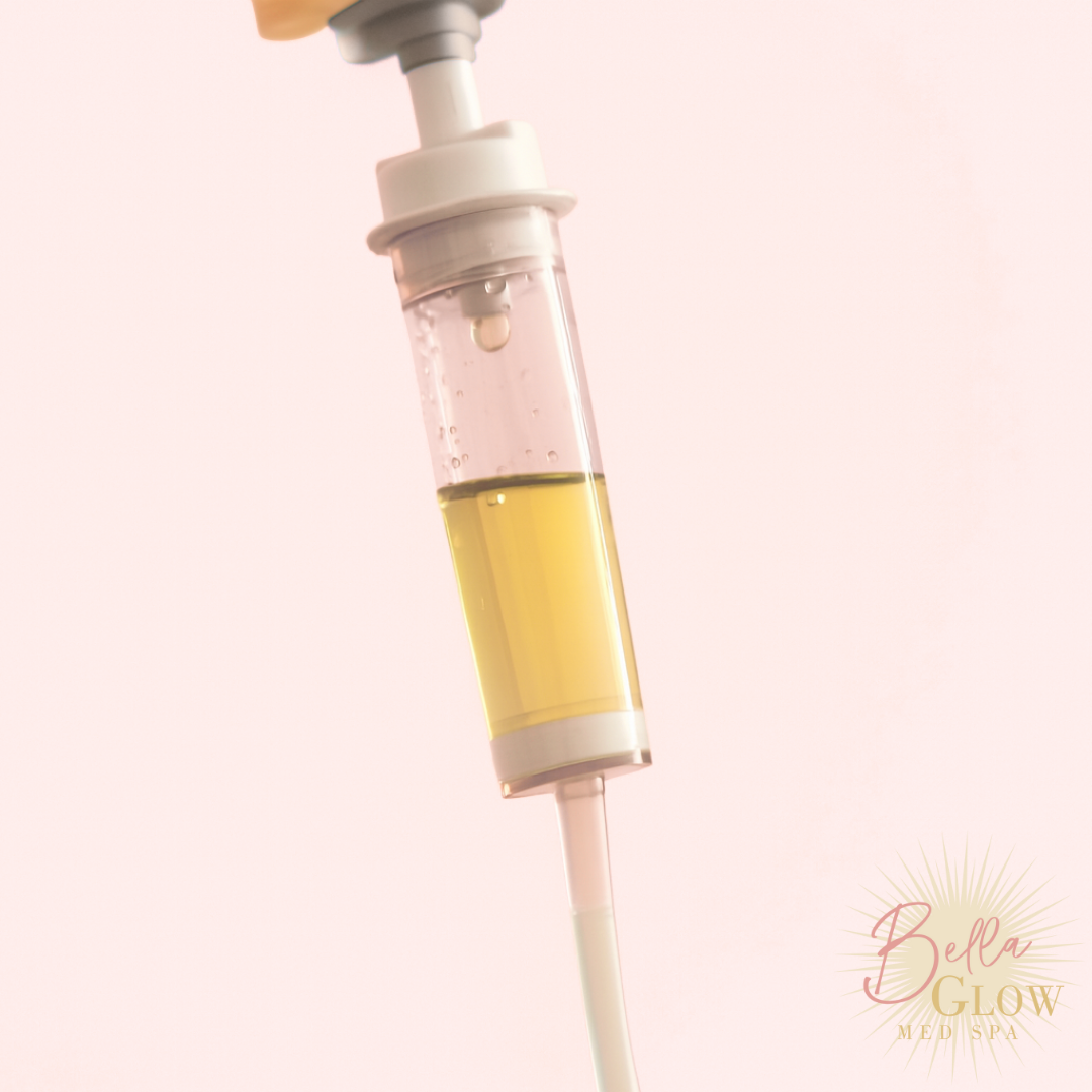 A syringe filled with a yellow liquid on a pink background.
