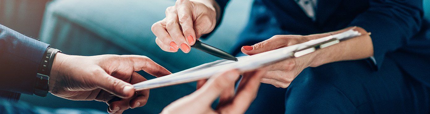 Hands Holding a legal document on a clip board